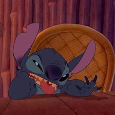 an animated image of stitch from the disney movie, stitch with its mouth open and tongue out