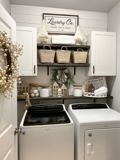 a white washer and dryer sitting in a kitchen next to a stove top oven