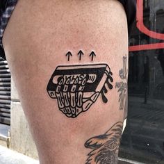 a man with a tattoo on his leg