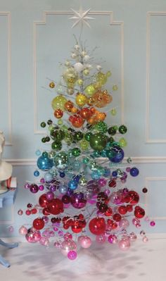 a christmas tree made out of glass balls