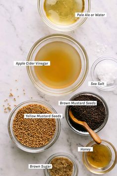 the ingredients to make an apple cider recipe on a white marble counter top with text overlay