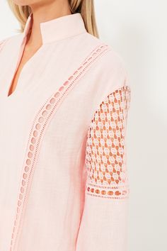 Extra cute thanks to the pale pink hue and eyelet detailing, the Jane Blouse will be playing on repeat in our closets this summer. With long blouson sleeves that feature delicately crafted cutouts and a relaxed, breezy fit that makes for effortless all day wear, you are sure to receive lots of compliments on this lightweight luxe style. A sweet way to dress up your most loved denim, from beach bonfires to al fresco spritzes with the gals, there's no wrong way to style this refreshingly chic top. Feminine Summer Eyelet Blouse, Feminine Eyelet Blouse For Spring, Spring Feminine Eyelet Blouse, Pink Blouson Sleeve Tops For Summer, Feminine Spring Top With Cutwork Hem, Feminine Spring Tops With Cutwork Hem, Feminine Eyelet Tops For Spring, Spring V-neck Eyelet Blouse, Chic Spring Tops With Cutwork Hem