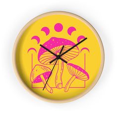 a yellow clock with pink mushrooms on it