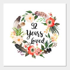 a floral wreath with the words 99 years loved