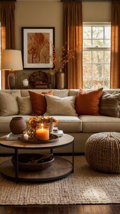 a living room filled with lots of furniture next to a window covered in brown curtains