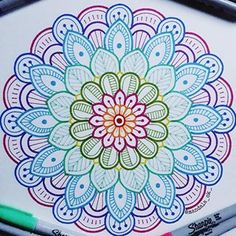 a coloring book with colored pencils and markers