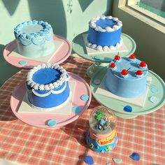 there are three cakes on the table ready to be eaten