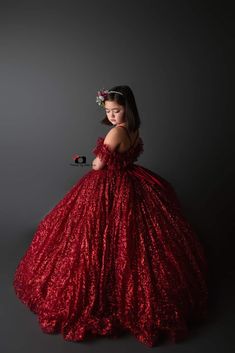 Our beautiful “Ruby Shimmer" – designed with a gorgeous red shimmer fabric- this gown is perfect for fine art portraits and so much more. Absolutely gorgeous in person - your little one will feel like a princess. For flex fitting we have added adjustable tie shoulder straps which you can lower or pull tighter and an elastic back which adds to the ease of size adjustment. Her skirting features bridal soft tulle underneath. An added built in petticoat gives the skirting a semi pouf. The skirting i Red Ball Gown With Fitted Bodice For Pageant, Red Ball Gown With Fitted Bodice For Pageants, Glamorous Red Ball Gown, Glamorous Red Ball Gown For Gala, Glamorous Ball Gown For Pageant, Glamorous Ball Gown For Pageants, Elegant Red Pageant Dress For Prom, Elegant Red Pageant Dress For Wedding, Red Floor-length Gown For Pageant