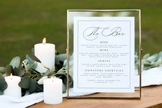 a table with candles and menu cards on it