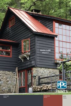 a black house with red trim and windows