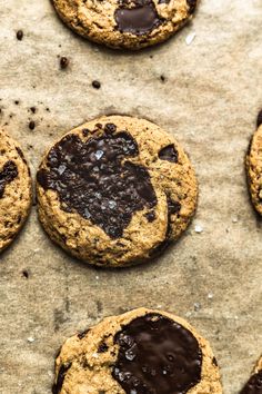 chocolate chip cookies are arranged on a baking sheet