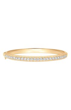 Dainty pavé diamonds illuminate a sleek bangle bracelet crafted from high-shine 18-karat yellow gold. 6" inner circumference Hinge with tongue-and-groove closure and safety clasp Total diamond weight: 2.33ct. Color: G–H Clarity: VS–SI 18k gold/diamond Imported >Diamond Guide Classic Gold Bangle Bracelet With Pave Setting, Classic Yellow Gold Bangle With Pave Setting, Timeless Yellow Gold Bangle With Pave Setting, Diamond Bangles Bracelet, Diamond Guide, Diamond Bangle, Pave Diamonds, Gold Diamond, Bangle Bracelets