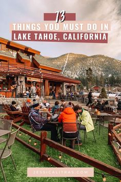 people sitting at tables in front of a lodge