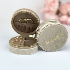 an open jewelry box with two wedding rings inside