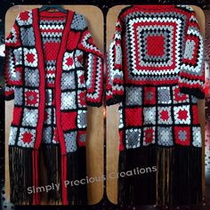 a crocheted jacket with fringes on it