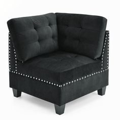 a black chair with studded arms and legs