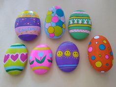 an assortment of painted easter eggs on a table