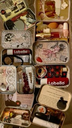 an open suitcase filled with lots of different types of jewelry and other things in it