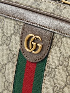 Gucci's 'Ophidia' bags have been a fan favourite ever since their debut in 2018. This version is crafted from coated-canvas that's printed with the brand's 'GG' monogram and trimmed with leather and signature webbing. It's fitted with an internal pocket for small items and an adjustable shoulder strap, so you can carry it cross-body. Luxury Beige Shoulder Bag With Logo, High-end Rectangular Shoulder Bag With Logo, Brown Luxury Shoulder Bag With Logo, Luxury Brown Shoulder Bag With Logo, Designer Rectangular Shoulder Bag With Logo, Gucci Beige Bag With Logo, Rectangular Shoulder Bag With Designer Logo For Travel, Rectangular Travel Shoulder Bag With Designer Logo, Luxury Shoulder Bag With Logo For Daily Use