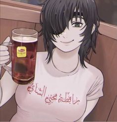 a woman holding a glass of beer in her hand