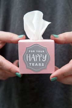 someone holding a tissue box that says for your happy tears