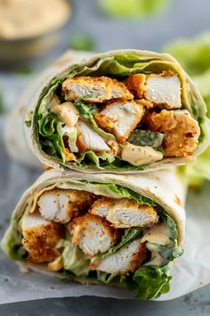 two wraps filled with chicken and lettuce