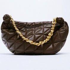 Rare Zara Genuine Leather Quilted Chunky Chain Strap Shoulder Bag -Gorgeous Geometric Quilted Leather W/Topstitching Detail Adds Striking Texture To This Shoulder Bag -Sold Out Online & In Stores -Soft Supple High Quality Genuine Sheep Leather -Lined Interior W/Zip Pocket Trimmed W/Leather, Zara Embossed Under Pocket,Chunky Zipper Pull -Chunky Chain Shoulder Strap,About 7” H Drop -About 9” H (Not Including Side Knots) 16” L 5“ W -Chocolate Brown -Matte/Antiqued Somewhat Textured/Hammered Gold Tone Hardware,Some Parts Of Chain Doesn’t Have Even Plating,In Pics,Intentional Matte/Texture,Not Scratched Or Damaged -Top Zip Closure W/Chunky Zipper Pull -Made From High Quality Leat Brown Chain Clutch Shoulder Bag, Leather Shoulder Bag With Gold Chain For Party, Leather Clutch Bag With Gold Chain, Trendy Leather Bags With Gold Chain, Leather Clutch With Gold Chain, Leather Shoulder Bag With Gold Chain For Evening, Evening Leather Shoulder Bag With Gold Chain, Party Brown Shoulder Bag With Chain, Brown Chain Bags