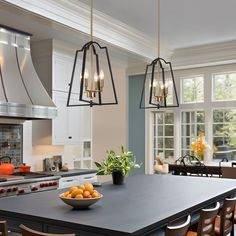 a bowl of fruit is sitting on the kitchen island