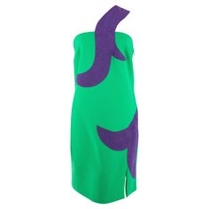 A contemporary Versace minidress in green with a swirled purple motif in purple suede. The motif then grows into the asymmetrical one shoulder. The dress also has a short thigh slit, finished with an invisible side zipper. Purple Suede, Asymmetrical Dress, Green And Purple, Side Zipper, Athletic Tank Tops, Versace, One Shoulder, Evening Dresses, The Dress