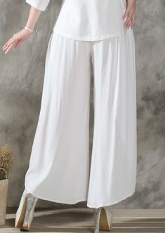 Fit Type: LoosePant Style: Wide Leg PantsFront Style: FlatWaist Type: MidFabric Type: BroadclothMaterial: Cotton, LinenLength: Ankle-Length PantsClosure Type: Elastic Waist SKU: 1475000 Color Pants, Solid Color Pants, Colored Pants, Ankle Length, Vintage Ladies, Elastic Waist, Wide Leg, Solid Color, Elastic