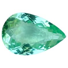 an oval shaped green gems on a white background