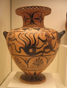 an old vase is on display in a museum