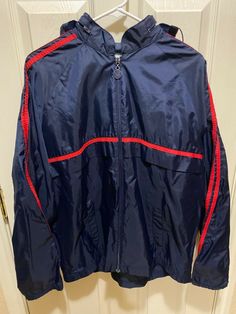 Vintage Men's Adidas Hoodie Zip Up Windbreaker Jacket Navy Blue & Red Size Large EXACT ITEM IS PICTURED ABOVE. FREE SHIPPING IN THE 50 STATES! DELIVERY CONFIRMATION IS ALWAYS INCLUDED! WE SHIP ALL ITEMS WITHIN 1 BUSINESS DAY. WE DO NOT SHIP ON WEEKENDS OR HOLIDAYS WHEN THE POST OFFICE IS CLOSED. WE OFFER RETURNS ON MOST ITEMS. PLEASE VIEW OUR RETURN POLICY PRIOR TO PURCHASING. WE DO NOT CANCEL PURCHASES FOR ANY REASON  _gsrx_vers_1271 (GS 8.3.4 (1271)) Adidas Hooded Windbreaker With Pockets, Navy Adidas Track Jacket For Sports, Adidas Navy Track Jacket For Sports, Navy Adidas Track Jacket For Streetwear, Adidas Navy Track Jacket For Streetwear, Adidas Navy Casual Track Jacket, Casual Adidas Navy Track Jacket, Casual Navy Adidas Track Jacket, Navy Adidas Outerwear For Sports