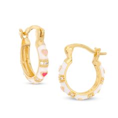 These child's cubic zirconia accented and multi-coloured enamel hearts hoop earrings are set in 18K gold plated brass. The earrings are secured with latch backs. Preppy Gold Hoop Earrings, Cute Cheap Earrings, Yellow Gold Enamel Huggie Jewelry, Enamel Huggie Jewelry Gift, Gold Enamel Hoop Jewelry, Yellow Gold Enamel Hoop Earrings For Pierced Ears, White Hoop Huggie Earrings, White Tarnish Resistant Hoop Earrings For Anniversary, White Tarnish-resistant Hoop Earrings For Anniversary