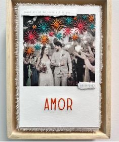 an embroidered photo frame with the word amr on it and fireworks in the background