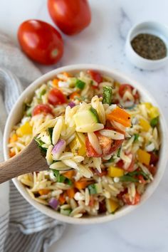 Rainbow Orzo Salad on a wooden spoon with a big bowl of rainbow orzo salad in the background. Colorful Salad, Best Pasta Salad, Orzo Salad, Salad Side Dishes, Pasta Salad Recipes, Side Salad, Orzo, Mediterranean Recipes, Summer Salads