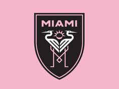 a pink and black emblem with two birds on it's chest, the word miami in