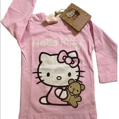 Hello Kitty Organic Long Sleeve Shirt 100% Organic Cotton Fiber Color Pink Size 6-12 Months $20 Kawaii Long Sleeve Top With Cat Design, Hello Kitty Long Sleeve Cotton Top, Long Sleeve Cotton Hello Kitty Top, Pink Long Sleeve Top With Cat Design, Pink Long Sleeve Tops With Cat Design, Hello Kitty Baby Clothes, Hello Kitty Shirts, Hello Kitty Shirt, Christmas Long Sleeve Shirts