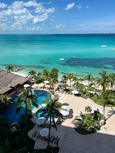 an aerial view of the beach and ocean from a hotel room in cancucilla, mexico