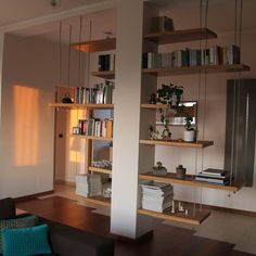 a living room filled with furniture and bookshelves