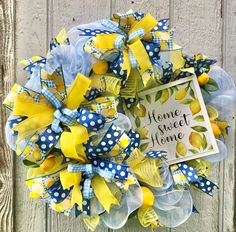 a yellow and blue wreath with the words home sweet home