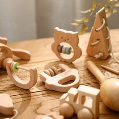 wooden toys are sitting on a table together