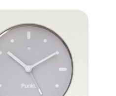 a clock with the word punkt on it's face and numbers in white