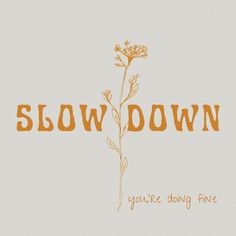 the words slow down are written in orange ink on a white background with an orange flower