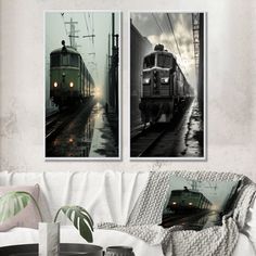 two black and white trains on tracks in the rain