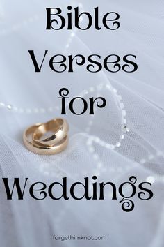 two wedding rings sitting on top of a white veil with the words bible verses for wedding