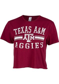 Let everyone know who you root for in this Texas A&M Aggies Maroon Divine Short Sleeve T-Shirt! This Texas A&M Short Sleeve Tee features a distressed center front team name graphic. Crop length, Raw edge details, Ribbed collar, 65% Polyester/35% Cotton, 4 Summer Fan Gear Graphic Tee Tops, Summer Fan Gear Graphic Tee, Summer Graphic Tee Tops For Fans, Collegiate Summer Tops For Cheerleading, Short Sleeve Cropped T-shirt With Letter Print For College, Cropped Short Sleeve Letter Print T-shirt For College, Cropped Short Sleeve T-shirt With Letter Print For College, Cropped Letter Print T-shirt For College, Collegiate Summer Fan Gear Tops