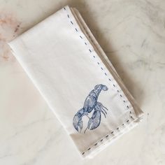 a napkin with a blue crab on it