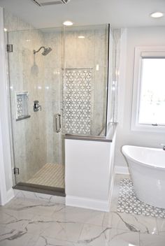 a bathroom with a tub, shower and sink