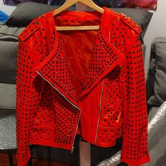 This Is A Custom Heavy Red,Black Or White Leather Jacket You Can Choose Which One All Have Black Studs Except The White One Has Chrome, That All Cost Me $550 Each Jacket. The Armpit Measures Are 22.5 Inches In Width. The Shoulder To The Bottom Of The Jacket Is 23 Inches. On Both Arms From The Shoulder Measure At 24 Inches In Length. The No Neck Line Is 25.5 Inches In Circumference Width With A 6.5 Inch Gap. Mid Waist Is 21 Inches Wide. Back Of The Neck Area To The Bottom Is 23.5 Inches In Length Party Outerwear With Rivets, Designer Long Sleeve Leather Jacket For Parties, Red Punk Style Spring Outerwear, Black Studded Leather Jacket, Leather Riding Jacket, Zoo Lights, Black Studs, Pink Leather Jacket, Studded Leather Jacket